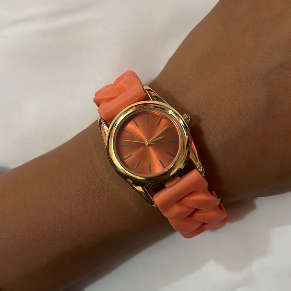 Orange watch with gold face